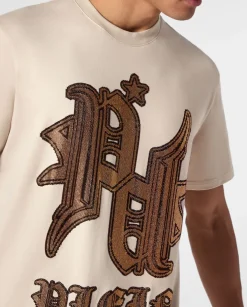Beżowy t-shirt z logo